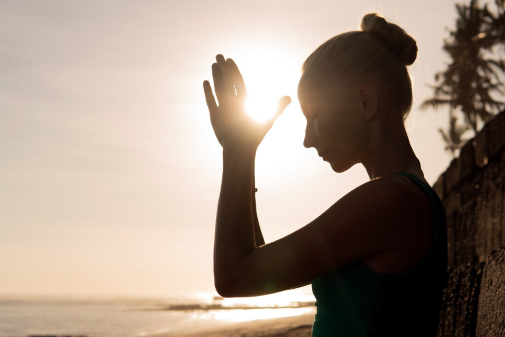 Devotional yoga practice at sunrise – expressing the meaning of Sun Salutations through breath and movement